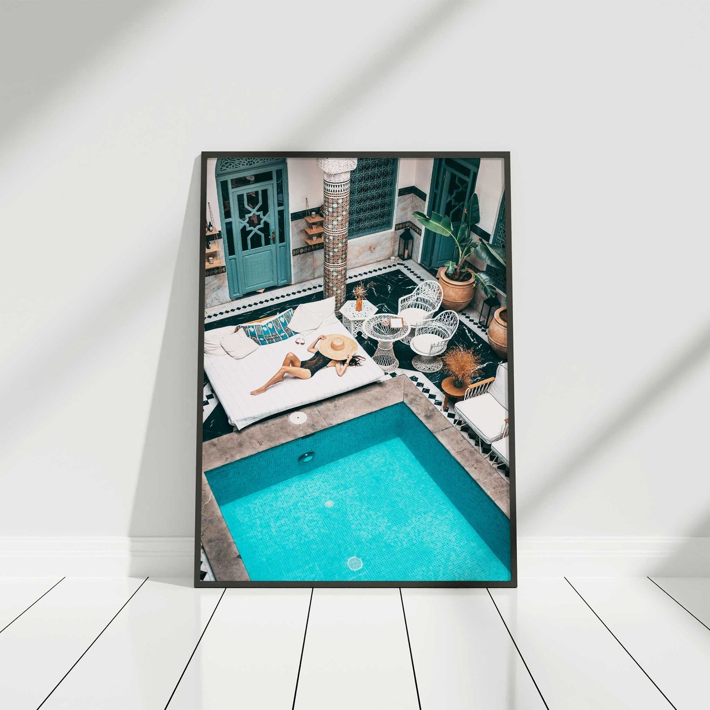 girl relaxing by pool print black frame mockup